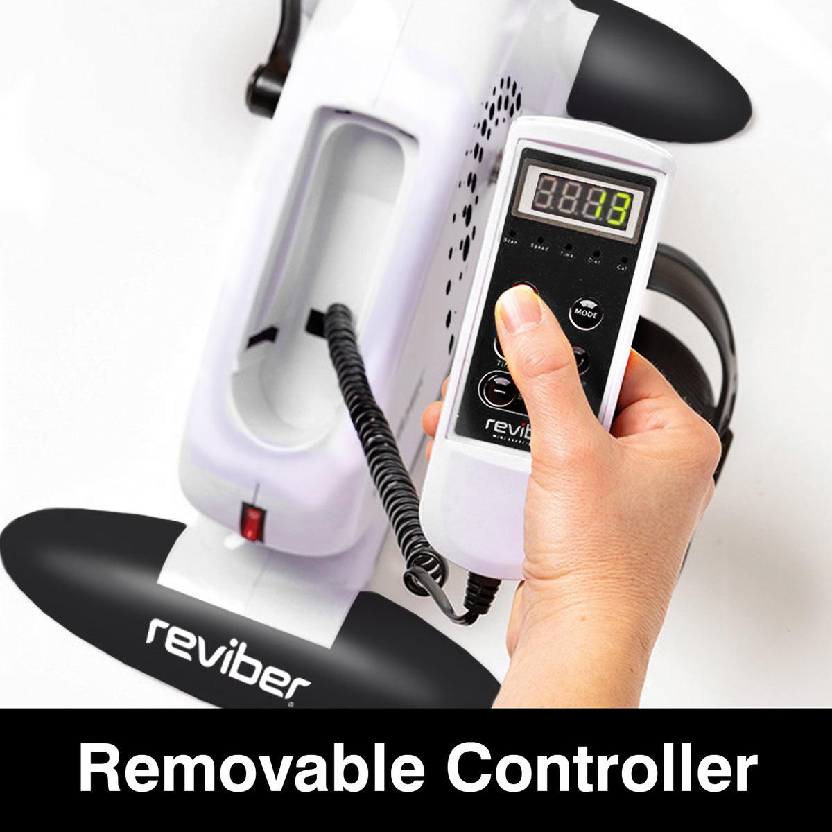 A hand holds the removable controller attached to the Reviber Mini Motorised Exercise Bike by Reviber, a white motorised exercise bike with black handles. The screen displays numbers, ideal for low-impact rehabilitation.