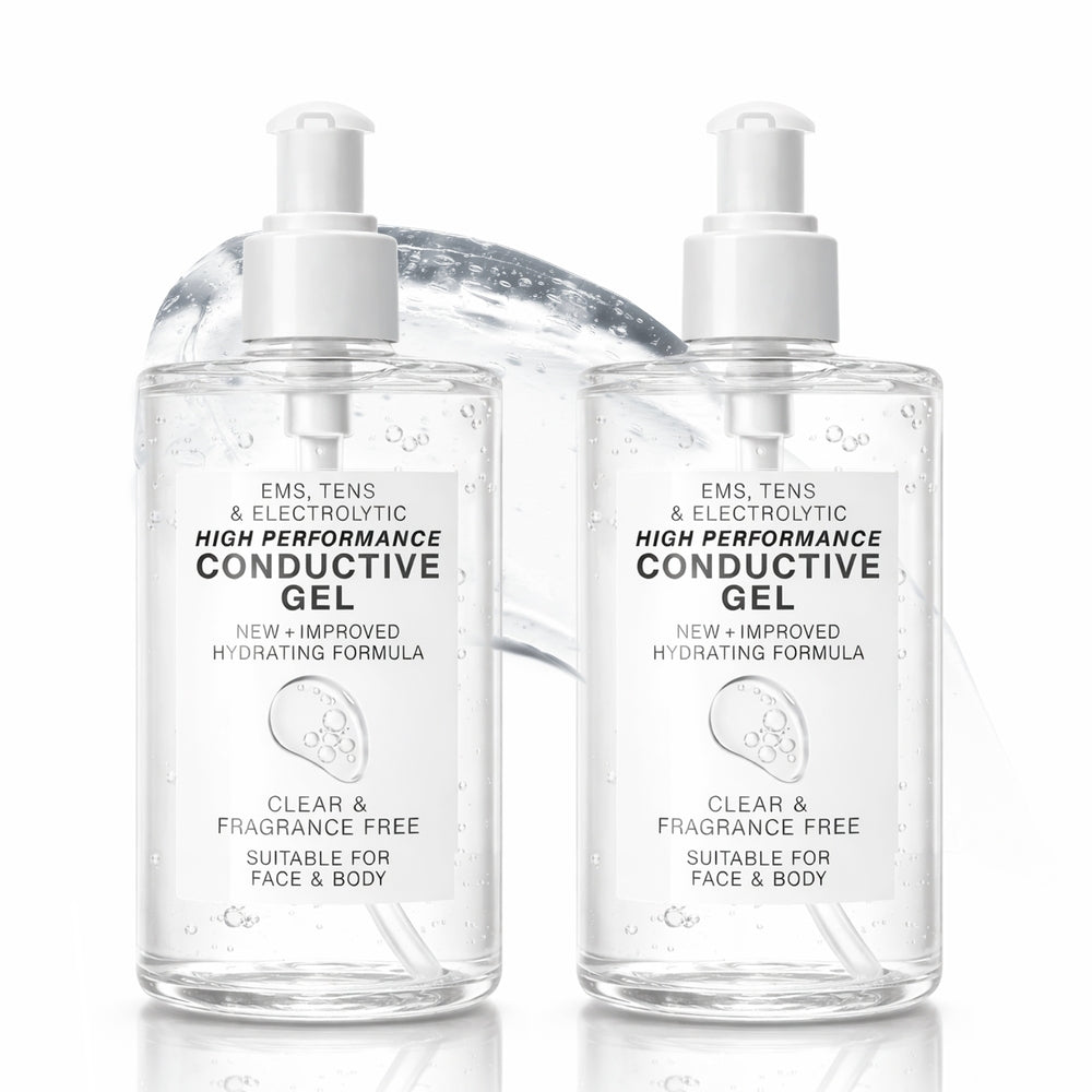 Two clear pump bottles of Reviber EMS, TENS, Electrolytic and Micro-Current Toning Conductive Gel (2 x 250ml) stand side by side with gel behind them. The labels indicate the gel is clear, fragrance-free, and suitable for face and body—ideal for use with EMS toning or any micro-current device.