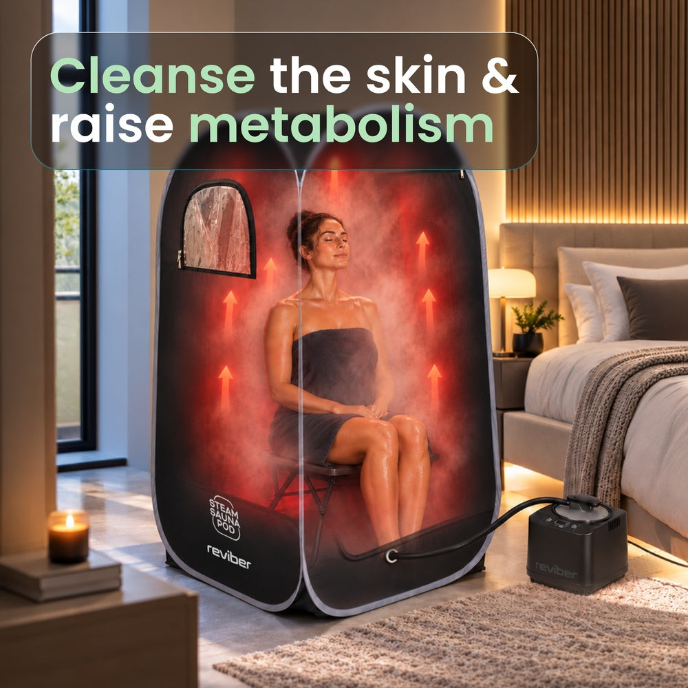 A person relaxes at home in a Reviber Steam Sauna Pod inside a bedroom, with the text Cleanse the skin & raise metabolism overlaid at the top.