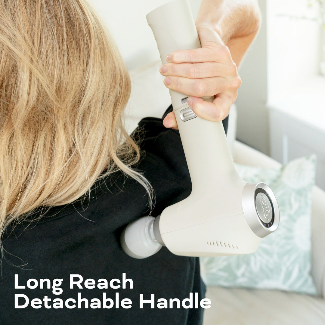 A person uses the Reviber Deep Tissue Percussion Massage Gun with Long Reach Handle on their upper back. Text reads, "Long Reach Detachable Handle." Several massage heads from Reviber are shown for customizable relief.