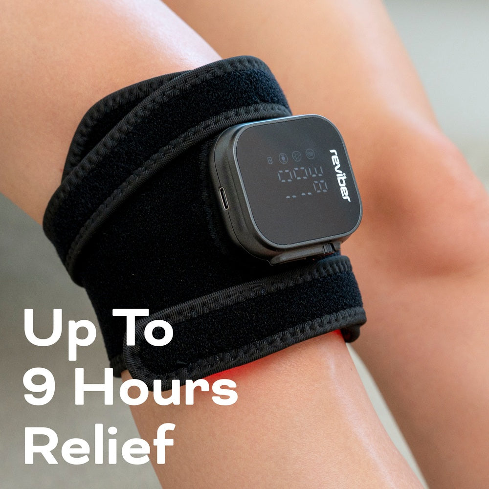 A close-up of a person's knee wearing the Reviber Infrared Light Therapy Pad, featuring built-in red light therapy, is shown with the text "Up To 9 Hours Relief" displayed over the image.